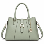 Sage green leather handbag with gold accents